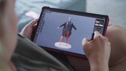 Poster - Caucasian woman creates model in 3D modeling design app using tablet computer and digital pen. Adult woman makes freelance working project lying on sofa at home. Lifestyle and remote work. Close Up.