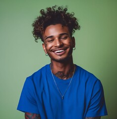 Wall Mural - A young man with curly hair smiling.