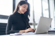 © Charlie's - Beautiful confident asian business woman working with laptop Hands typing  keyboard. Professional investor working new start up project. business planning in office. Technology business