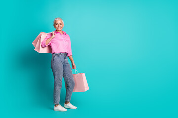 Canvas Print - Full size photo of pretty aged woman store bags empty space wear shirt isolated on teal color background