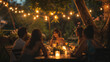 © Sadia - Friends Enjoying Dinner Under String Lights at an Outdoor Evening Gathering