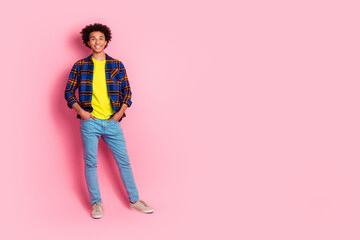 Sticker - Photo of young man wear plaid clothes hands pockets empty space isolated on pink color background