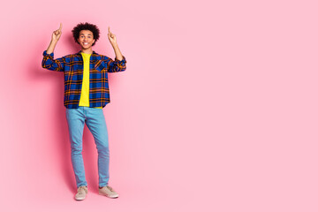 Canvas Print - Photo of glad funny man wear plaid clothes demonstrate empty space proposition isolated on pink color background