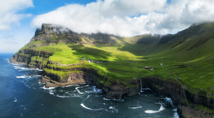 Canvas Print - View from flying drone. Majestic morning scene of Mulafossur Waterfall. Stunning summer view of Vagar island, Faroe Islands, Denmark, Europe.