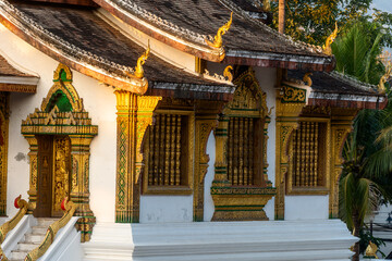 details of the roof and facade of Wat Ho Pha Bang temple in Luang Prabang