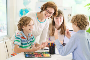 Wall Mural - Back to school. Kids and teacher in classroom