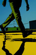 © yaqui_villegas - This image shows a person walking briskly across a sunlit industrial area, with their shadow and reflection prominently featured on the ground, evoking themes of movement and solitude.