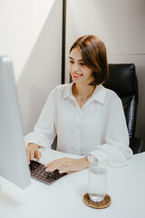 Canvas Print - Young Woman Working at Office Desk