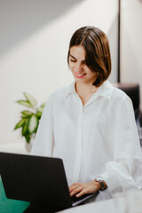 Canvas Print - Woman Working on Laptop in Modern Office