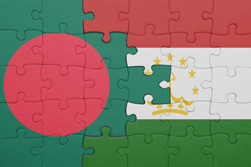 Wall Mural - puzzle with the colourful national flag of bangladesh and flag of tajikistan .