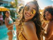 © Alexander Chaykin - A group of young women socializing and relaxing near a swimming pool