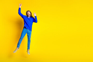 Poster - Photo of worried nervous funny man wear trendy blue clothes empty space isolated on yellow color background