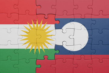 Wall Mural - puzzle with the colourful national flag of kurdistan and flag of laos .