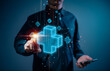 © teerawat - A businessman is depicted reaching out to a virtual blue plus sign, symbolizing the offering of positive aspects such as benefits, personal development, and health insurance.