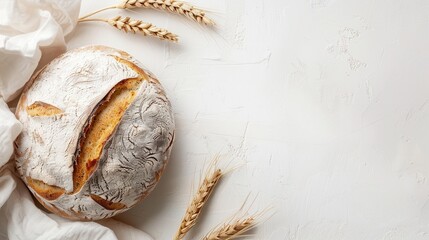 Poster - A freshly baked loaf of bread with wheat flour on a white background, with wheat stalks on either side. Generative AI