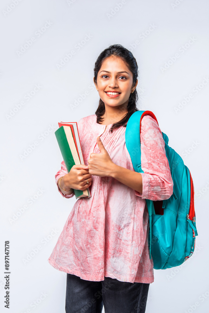 Portrait of happy asian indian young college girl with backpack, laptop ...
