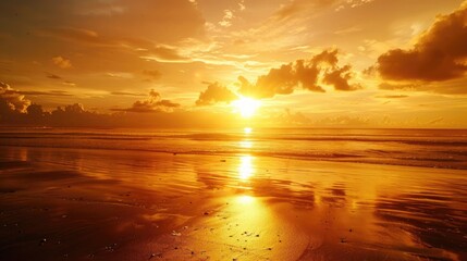 Poster - A breathtaking view of the golden sunrise on the beach, with a calm sea reflecting the light. 