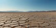 © Den Boro Day - dry lake in a desert with cracked floor vast blue sky.