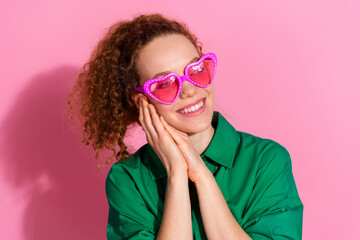 Wall Mural - Photo of shiny attractive lady dressed green shirt heart eyewear smiling empty space isolated pink color background