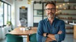 © ifoto - A company's director standing in front of an office table with green chairs
