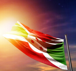 Burundi national flag waving in dramatic dark sunlight. Burundi national flag for independence day.