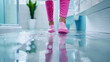 © Oranuch - A person walks in bright pink slippers on a wet bathroom floor, creating a cheerful and vibrant atmosphere.