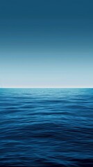 Poster - The deep blue ocean meets the pale sky. Creating a serene seascape perfect for daydreaming about paradise.Rippling waves add movement to this tranquil scene