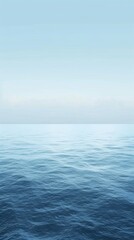 Poster - The serene blue of a calm ocean surface blends seamlessly with a pale blue sky, creating a tranquil and minimalist background