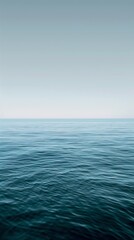 Poster - The deep blue ocean meets the sky, creating a serene scene under a clear blue sky. Calming waves ripple across the surface, offering a tranquil seascape that evokes freedom and solitude