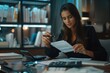 © Bule - Concentrated Woman Analyzing Documents at Desk