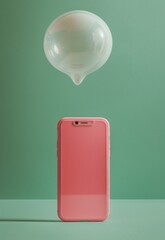 Poster - Pink smartphone with green speech bubble on pastel background symbolizing communication and social media