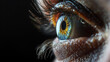 © Elena - Close up of a wide open human eye on black background