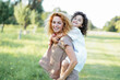 © Kristina89 - Happy mother and little daughter playing outdoors. Curly redhead model in the field. Relations.