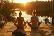 © Maksim - Couple practicing serene partner yoga at sunset on a peaceful lakeside deck