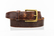 © Mareks - Real natural Leather belt. Leather brown belt on white background, vintage retro leather belt with gold buckle