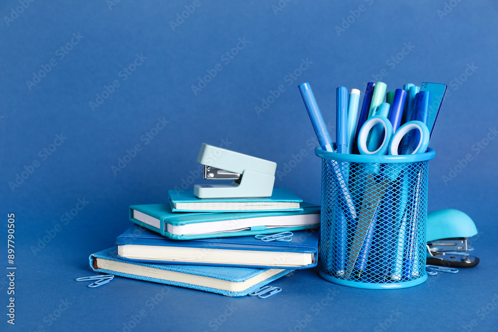 School supplies on blue background