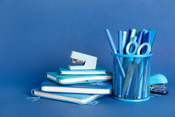 school supplies on blue background