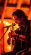 © lertsakwiman - An artist performing an acoustic guitar set in a cozy, illuminated venue with warm lights creating an inviting atmosphere.