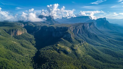 Wall Mural - Marvel at the majesty of towering mountain ranges with an aerial view that highlights their grandeur.