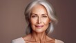 © Elena - Portrait of a Caucasian, elderly woman with blonde hair, showcasing a beautiful, natural face and healthy, radiant skin.