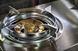 © escapejaja - Close-up shot of a modern gas stove burner,
