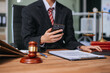 © laddawan - justice and law concept.law the desk, books, balance. male judge in a courtroom the gavel,working with digital tablet, smartphone