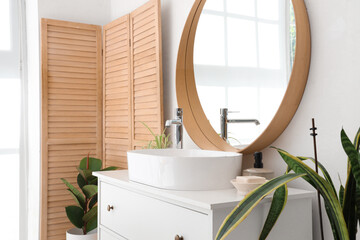 Poster - Sink with soap on drawers and mirror in bathroom