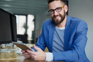 Poster - Businessman, portrait and happy with tablet in office for reading interview transcript, news articles and press release. Male journalist, pride and online for headlines or updates and trending topics