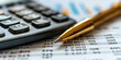 © khonkangrua - A golden pen and calculator placed on financial documents with numerical data, representing financial planning and analysis.