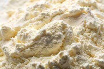 Wall Mural - Soft, powdery, and creamy white flour forms a smooth, even texture, creating a warm and inviting background with subtle shadows and gentle ridges.