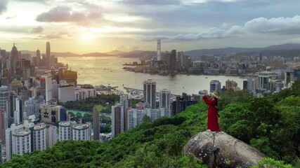 Wall Mural - Tourists enjoying landscape from viewpoint in Hong Kong.