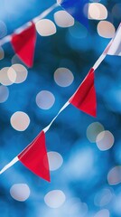 Wall Mural - Red and blue bunting against blurred lights