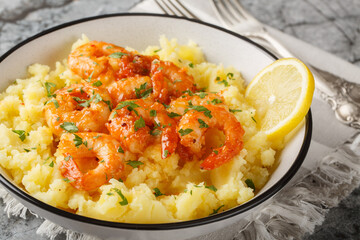 Wall Mural - Garlicky Lemon Shrimp with Mashed Potatoes closeup on the plate on the table. Horizontal