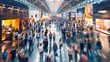 © Oulaphone - Blurred of Trade fair expo trade show booth international business convention event showcase center with large scale crowd of people gathering to see product and service display.